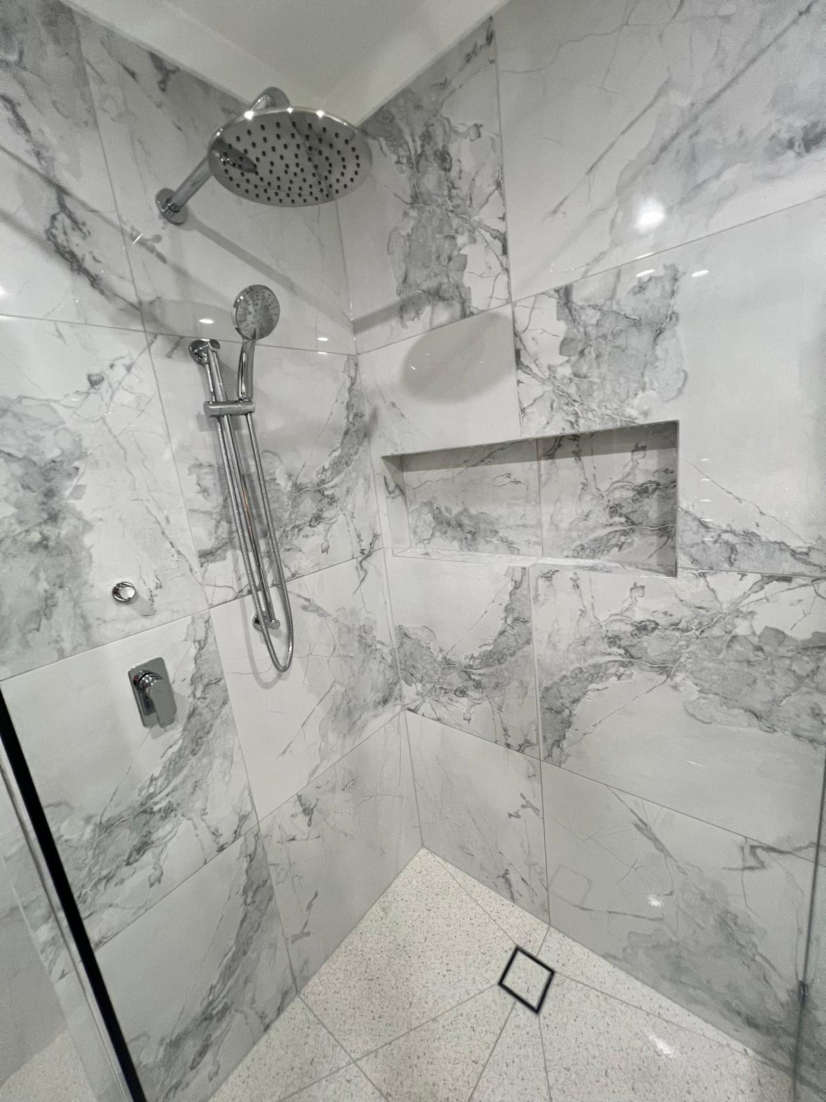 Marble tile shower niche